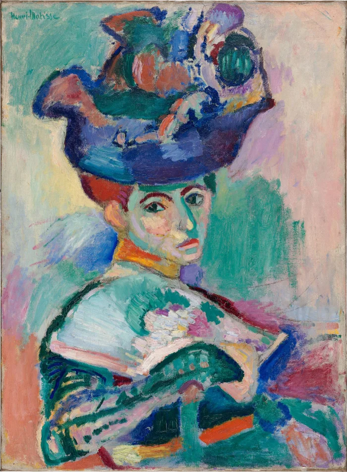 A woman in an enormous flowered hat. Her face is built from green, yellow and violet, and the background is every colour at once.