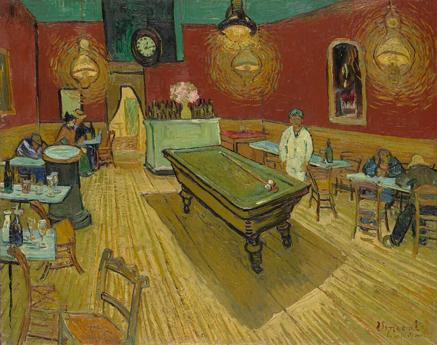 An almost empty café at night, painted in clashing red and green under glaring yellow lamps. The room feels uneasy rather than welcoming.