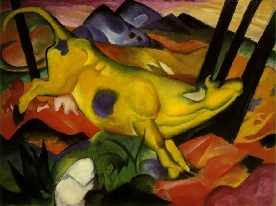 A bright yellow cow leaping across a landscape of blue hills and red earth, with all four feet off the ground and its tail up.